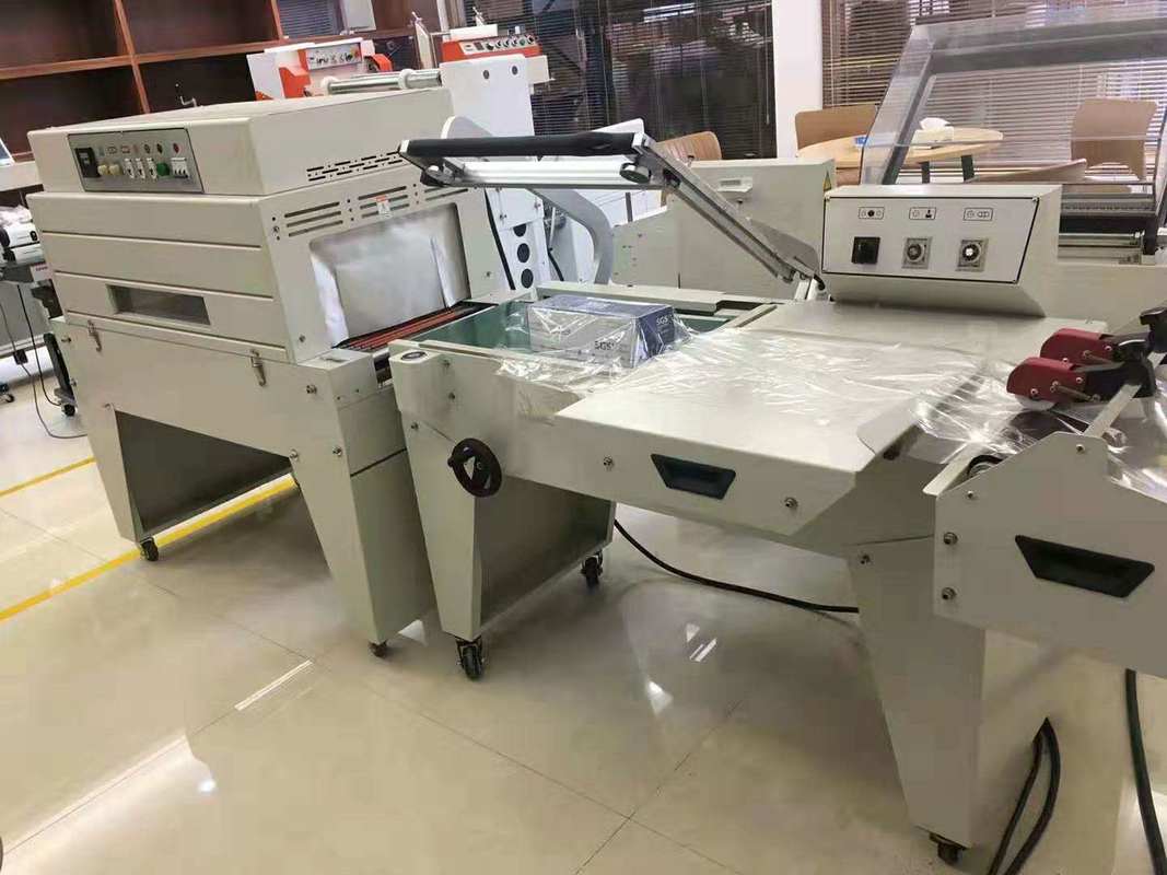 FQL-450+BSE-4525 L bar Heat Tunnel Shrinking Wrapping Sealing Machine for Small Business छोटे व्यवसायों के लिए हीट टनेल सिकुड़ने वाली पैकेजिंग सीलिंग मशीन